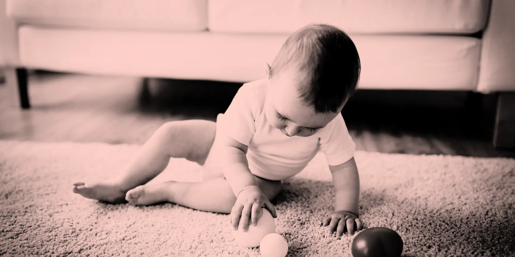 baby playing with a ball